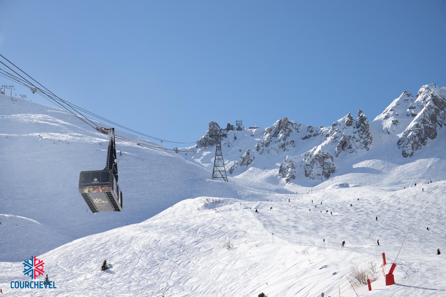 Gondola taking skiiers to top of french alps mountain