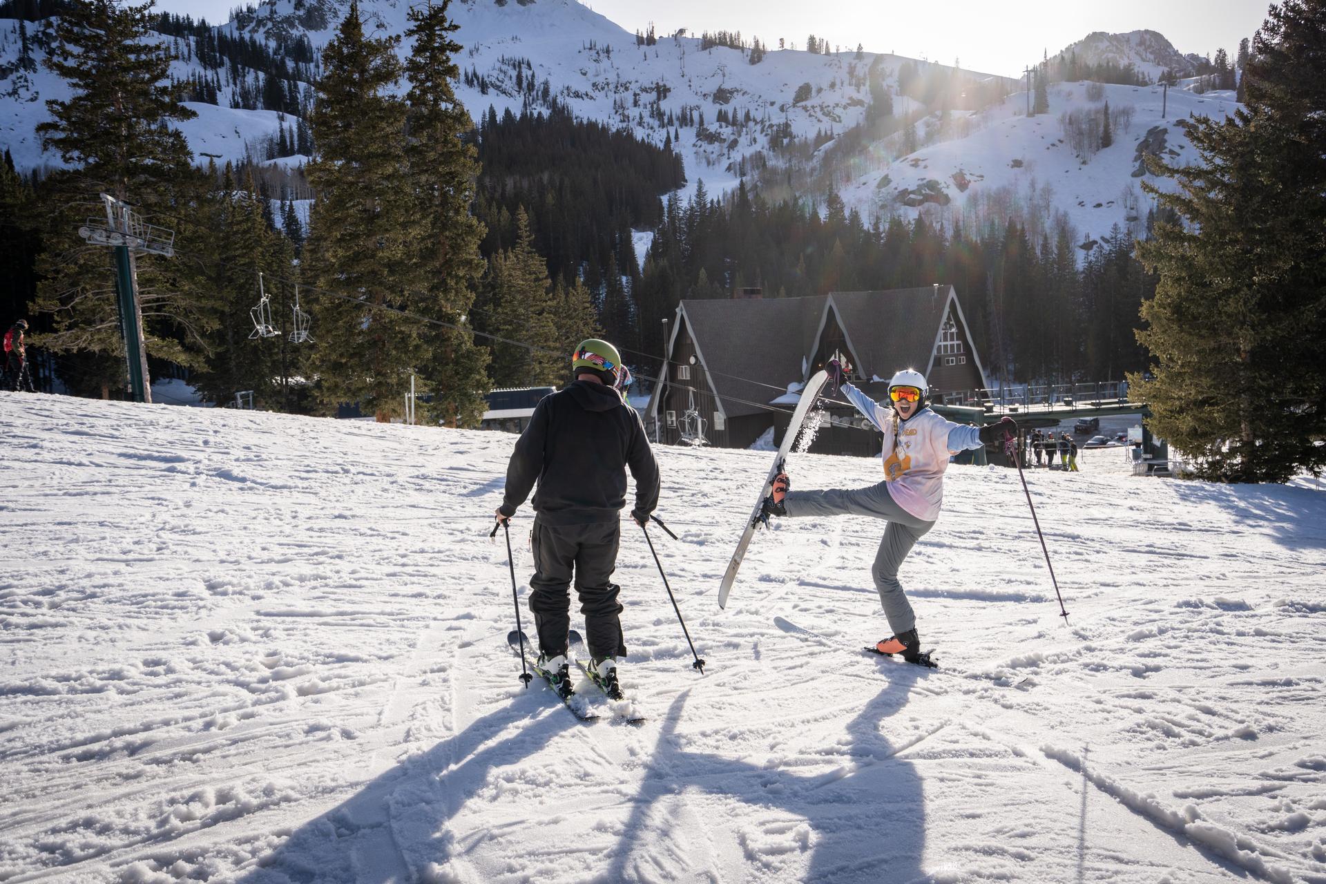 Friends having fun skiing and posing for photo